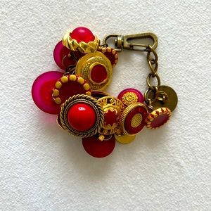 Red button bracelet.